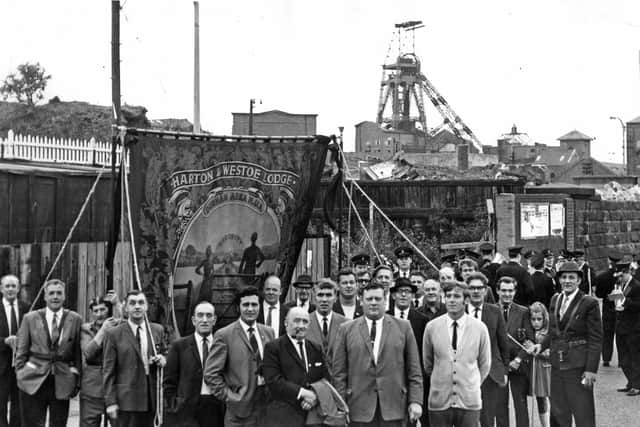 Picture from 1970 as the banner of Harton and Westoe Miners' Lodge hung high outside the empty buildings of Harton Colliery, closed the previous year.  Lodge officials and members were pictured outside the former pit before marching to South Shields station on their way to the Durham Gala.