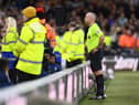Referee Paul Tierney checks a Newcastle United goal on the VAR screen during the Premier League match between Nottingham Forest and Newcastle United at City Ground on March 17, 2023 in Nottingham, England. (Photo by Shaun Botterill/Getty Images)