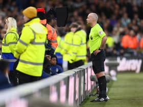 Referee Paul Tierney checks a Newcastle United goal on the VAR screen during the Premier League match between Nottingham Forest and Newcastle United at City Ground on March 17, 2023 in Nottingham, England. (Photo by Shaun Botterill/Getty Images)