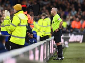 Referee Paul Tierney checks a Newcastle United goal on the VAR screen during the Premier League match between Nottingham Forest and Newcastle United at City Ground on March 17, 2023 in Nottingham, England. (Photo by Shaun Botterill/Getty Images)