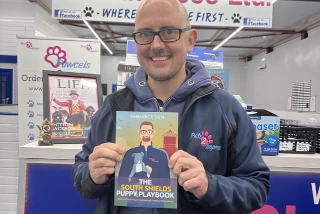 Owner of Pets2Impress Tim Jackson, with a copy of the South Shields Puppy Playbook