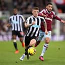 Kieran Trippier of Newcastle United runs ahead of Said Benrahma of West Ham United during the Premier League match between Newcastle United and West Ham United at St. James Park on February 04, 2023 in Newcastle upon Tyne, England. (Photo by George Wood/Getty Images)