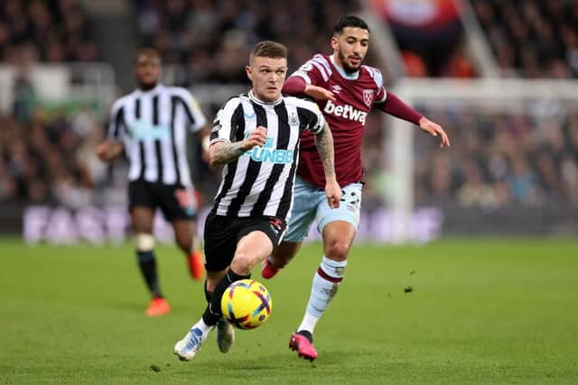 Kieran Trippier of Newcastle United runs ahead of Said Benrahma of West Ham United during the Premier League match between Newcastle United and West Ham United at St. James Park on February 04, 2023 in Newcastle upon Tyne, England. (Photo by George Wood/Getty Images)