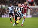 Kieran Trippier of Newcastle United runs ahead of Said Benrahma of West Ham United during the Premier League match between Newcastle United and West Ham United at St. James Park on February 04, 2023 in Newcastle upon Tyne, England. (Photo by George Wood/Getty Images)