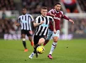 Kieran Trippier of Newcastle United runs ahead of Said Benrahma of West Ham United during the Premier League match between Newcastle United and West Ham United at St. James Park on February 04, 2023 in Newcastle upon Tyne, England. (Photo by George Wood/Getty Images)
