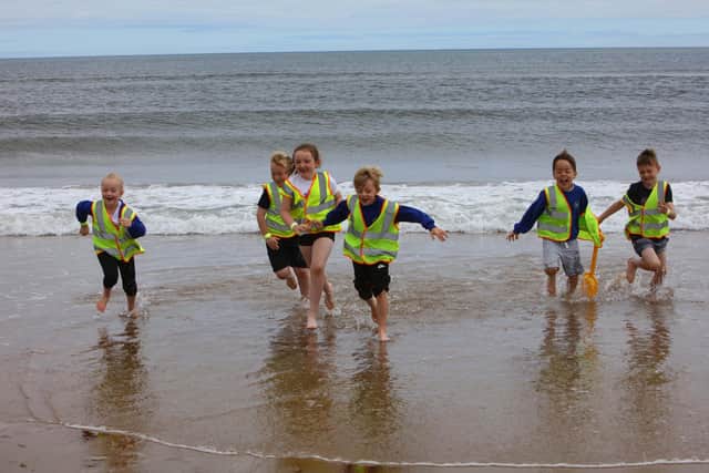 Children enjoy the beach at a previous Sandcastle Challenge.