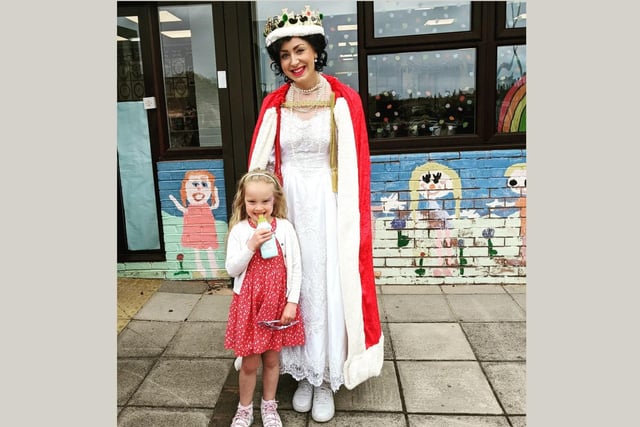 Lydia Ballands, age 5, meets the 'Queen' - also known as Mrs Beattie at Mortimer Primary School.