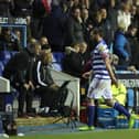 Reading striker Andy Carroll leaves the pitch after being sent off.