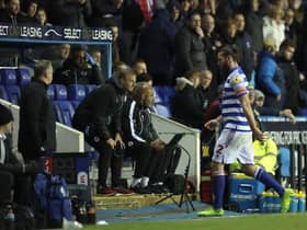 Reading striker Andy Carroll leaves the pitch after being sent off.