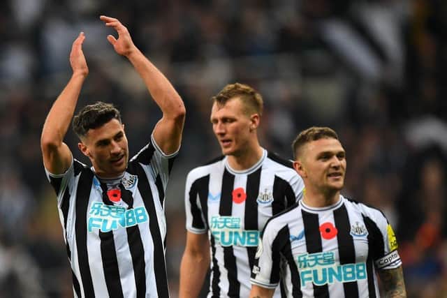 Newcastle United's Swiss defender Fabian Schar (L) celebrates after the final whistle of the English Premier League football match between Newcastle United and Chelsea at St James' Park in Newcastle-upon-Tyne, north east England on November 12, 2022.  (Photo by ANDY BUCHANAN/AFP via Getty Images)