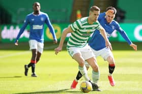 Ajer of Celtic vies with Ianis Hagi of Rangers during the Ladbrokes Scottish Premiership match between Celtic and Rangers at Celtic Park.