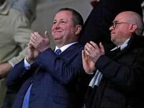 Newcastle United's English owner Mike Ashley (L) and director Lee Charnley (R) applaud after Newcastle take the lead during the FA Cup fourth round replay football match between Oxford United and Newcastle United at the Kassam Stadium in Oxford, west of London, on February 4, 2020.