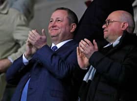 Newcastle United's English owner Mike Ashley (L) and director Lee Charnley (R) applaud after Newcastle take the lead during the FA Cup fourth round replay football match between Oxford United and Newcastle United at the Kassam Stadium in Oxford, west of London, on February 4, 2020.