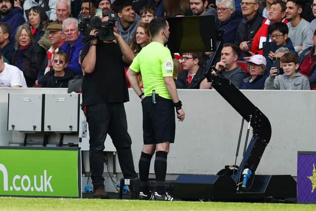 Chris Kavanagh overturned his initial decision not to award a penalty (Photo by Clive Rose/Getty Images)