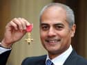 George Alagiah at Buckingham Palace after collecting his OBE from the Queen.