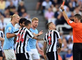 Kieran Trippier was shown a red card by referee Jarred Gillett which was later overturned to a yellow card during Newcastle United's 3-3 draw with Manchester City (Photo by Stu Forster/Getty Images)