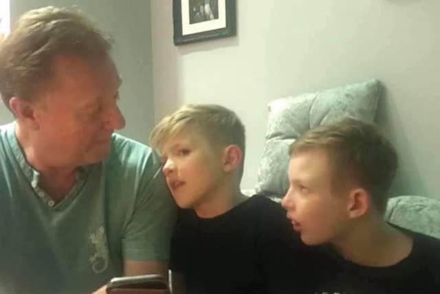 John with his grandchildren Marcus and Ollie.