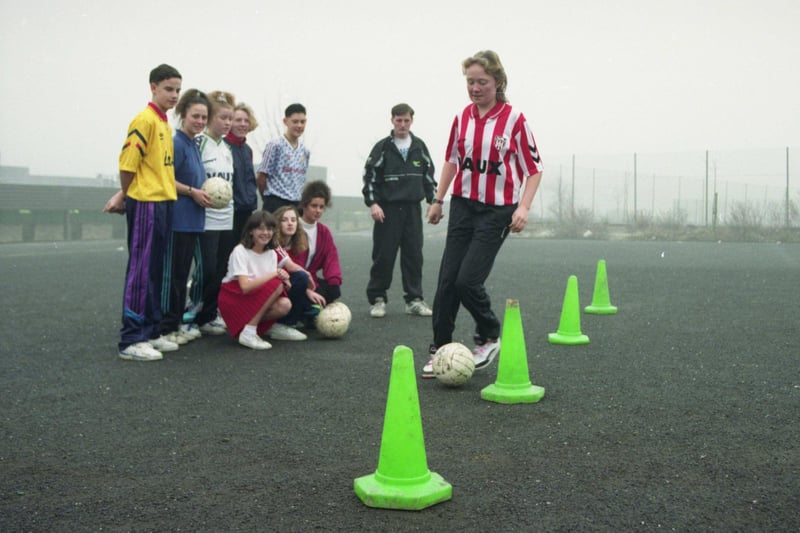 Oxclose Comprehensive School, Washington was chosen as a venue for the Manchester based Bobby Charlton Celebrity Soccer Schools course which took place in February 1992.  Lisa Grieves shows her skills, watched by fellow footballers and PE teacher and coach Joe Quinn.