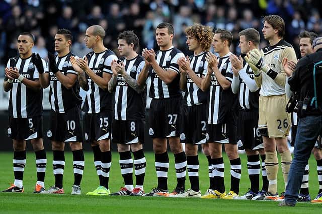 Newcastle United players acknowledge a minute's applause in honour of the late Gary Speed.