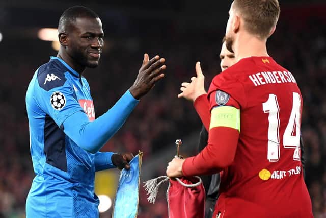 LIVERPOOL, ENGLAND - NOVEMBER 27: Kalidou Koulibaly of Napoli shakes hands with Jordan Henderson of Liverpool prior to the UEFA Champions League group E match between Liverpool FC and SSC Napoli at Anfield on November 27, 2019 in Liverpool, United Kingdom. (Photo by Michael Regan/Getty Images)