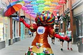 Charity champion Colin Burgin-Plews in the rainbow dress he will wear for this weekend's charity walk.