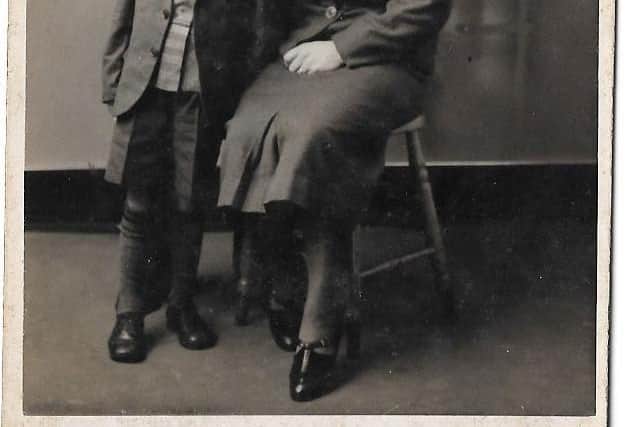 George pictured with his mum Mamie and dad, also called George.