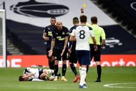 Jonjo Shelvey is booked for a foul on Giovani Lo Celso.