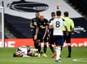 Jonjo Shelvey is booked for a foul on Giovani Lo Celso.