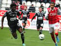 Reims' French forward Hugo Ekitike (R) fights for the ball withBrest's French defender Lilian Brassier (L) during the French L1 football match between Reims and Brest at the Auguste Delaune Stadium in Reims, on February 20, 2022. (Photo by FRANCOIS NASCIMBENI / AFP)