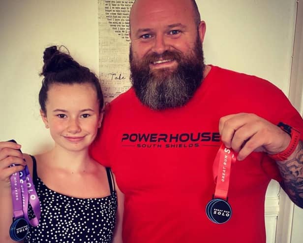 Graham Erickson and his daughter Nicole after they completed their first GNR challenges.
