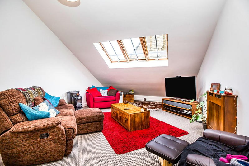 There are three Velux-style windows providing light to the lounge area.