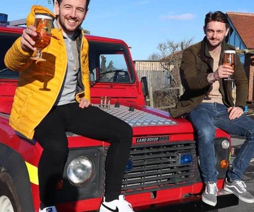 Chris Joyce, left, and business partner Connor Robinson with their Bait and Beer fire engine.