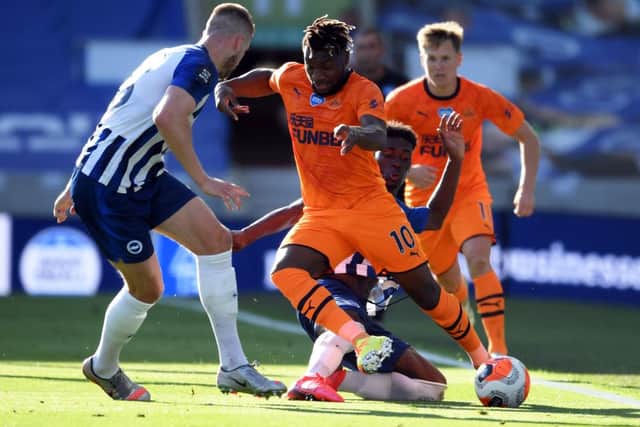 BRIGHTON, ENGLAND - JULY 20: Allan Saint-Maximin of Newcastle United is tackled by Yves Bissouma of Brighton and Hove Albion during the Premier League match between Brighton & Hove Albion and Newcastle United at American Express Community Stadium on July 20, 2020 in Brighton, England. Football Stadiums around Europe remain empty due to the Coronavirus Pandemic as Government social distancing laws prohibit fans inside venues resulting in all fixtures being played behind closed doors. (Photo by Andrew Couldridge/Pool via Getty Images)