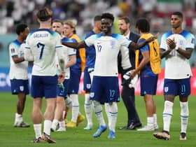 England's Bukayo Saka with Jack Grealish following the FIFA World Cup Group B match at the Khalifa International Stadium, Doha.