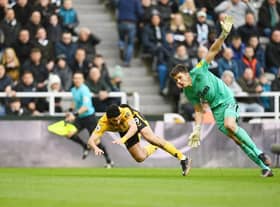 Raul Jimenez of Wolverhampton Wanderers and Nick Pope of Newcastle United collide during the Premier League match between Newcastle United and Wolverhampton Wanderers at St. James Park on March 12, 2023 in Newcastle upon Tyne, England. (Photo by Michael Regan/Getty Images)