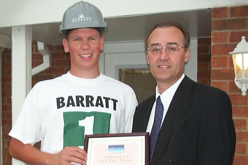 Barratt Sheffield's apprentice of the year Aaron Brookes receives his award from managing director Ian Pendlebury in 2002