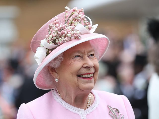 Queen Elizabeth II meeting guests during a Royal Garden Party at Buckingham Palace in London.