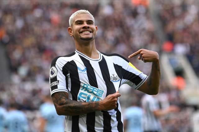Newcastle player Bruno Guimaraes celebrates his second goal by pointing to the club badge during the Premier League match between Newcastle United and Brentford FC at St. James Park on October 08, 2022 in Newcastle upon Tyne, England. (Photo by Stu Forster/Getty Images)