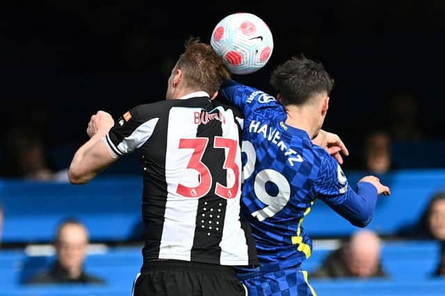 Newcastle United's English defender Dan Burn (L) vies in the air with Chelsea's German midfielder Kai Havertz during the English Premier League football match between Chelsea and Newcastle United at Stamford Bridge in London on March 13, 2022. (Photo by JUSTIN TALLIS/AFP via Getty Images)