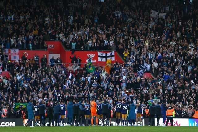 Newcastle United fans celebrate their 4-1 win over Southampton at St Mary's (Photo by Charlie Crowhurst/Getty Images)