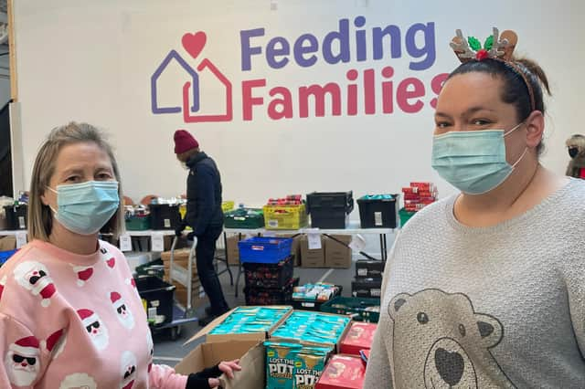 Janet Defty and Gaynor Bryden with items ready to be packaged up and sent out by Feeding Families.