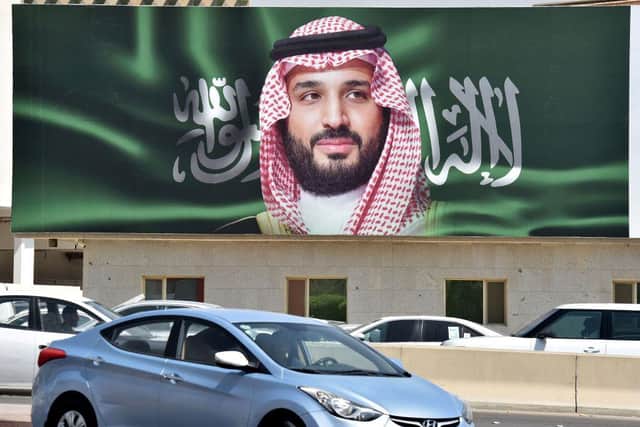 A picture taken on October 22, 2018 shows a portrait of Saudi Crown Prince Mohammed bin Salman (MBS) in the capital Riyadh one day ahead of the Future Investment Initiative FII conference that will take place in Riyadh from 23-25 October. - Saudi Arabia will host a key investment summit overshadowed by the killing of critic Jamal Khashoggi that has prompted a wave of policymakers and corporate giants to withdraw.