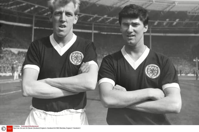 Jim Baxter (right) with Scotland teammate Ian Ure at Wembley in 1963