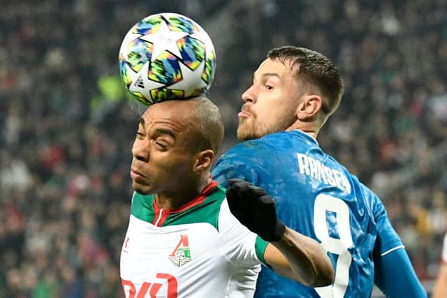 Lokomotiv Moscow's Portuguese midfielder Joao Mario and Juventus' Welsh midfielder Aaron Ramsey vie for the ball during the UEFA Champions League group D football match between FC Lokomotiv Moscow and Juventus at Moscow's RZD Arena stadium on November 6, 2019. (Photo by Dimitar DILKOFF / AFP) (Photo by DIMITAR DILKOFF/AFP via Getty Images)