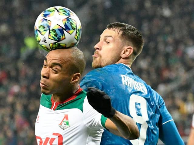 Lokomotiv Moscow's Portuguese midfielder Joao Mario and Juventus' Welsh midfielder Aaron Ramsey vie for the ball during the UEFA Champions League group D football match between FC Lokomotiv Moscow and Juventus at Moscow's RZD Arena stadium on November 6, 2019. (Photo by Dimitar DILKOFF / AFP) (Photo by DIMITAR DILKOFF/AFP via Getty Images)
