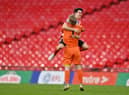 Lee Burge of Sunderland celebrates victory with teammate Luke O'Nien following the Papa John's Trophy Final match between Sunderland and Tranmere Rovers.