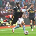 Allan Saint-Maximin of Newcastle United is challenged by Douglas Luiz of Aston Villa during the Premier League match between Aston Villa and Newcastle United at Villa Park on August 21, 2021 in Birmingham, England. (Photo by Ryan Pierse/Getty Images)