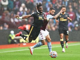 Allan Saint-Maximin of Newcastle United is challenged by Douglas Luiz of Aston Villa during the Premier League match between Aston Villa and Newcastle United at Villa Park on August 21, 2021 in Birmingham, England. (Photo by Ryan Pierse/Getty Images)