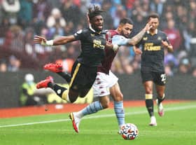Allan Saint-Maximin of Newcastle United is challenged by Douglas Luiz of Aston Villa during the Premier League match between Aston Villa and Newcastle United at Villa Park on August 21, 2021 in Birmingham, England. (Photo by Ryan Pierse/Getty Images)