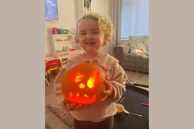 Elodie, age 2, shows off her pumpkin creation! Well done! Celebrating National Pumpkin Day and Halloween with Laura Forbes and Elodie.
